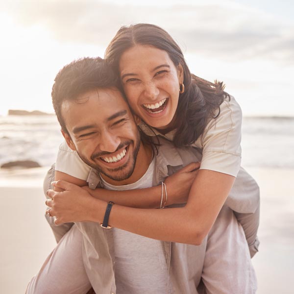 laughing couple on the beach