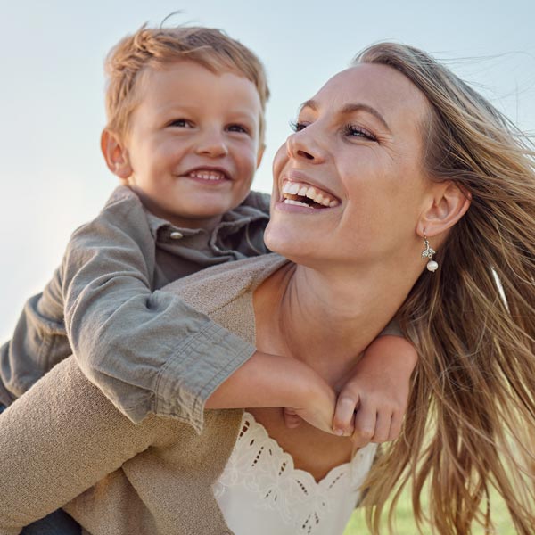 mother and young son laughing